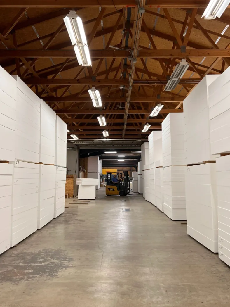 A long aisle between stacks of foam insulation blocks