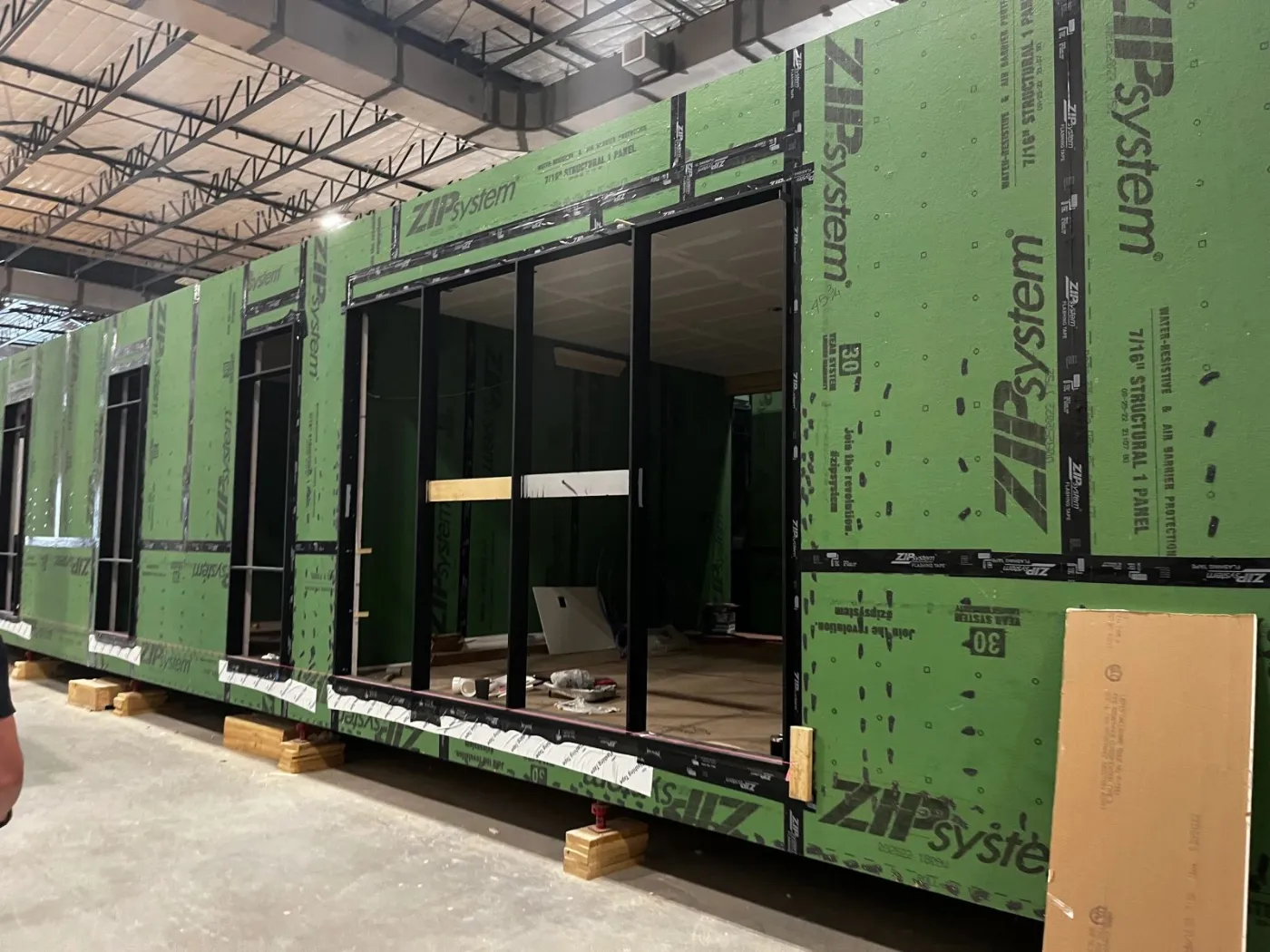 A module wrapped in green sheathing, seen along its length