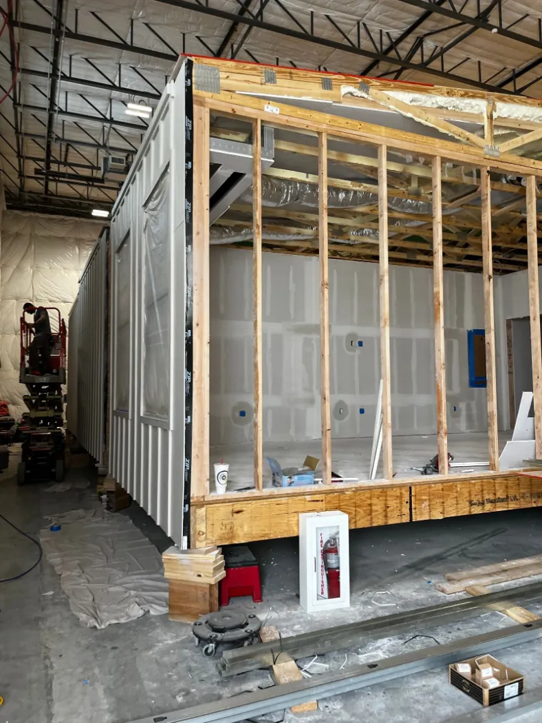 Module walls framed with window openings on the production floor