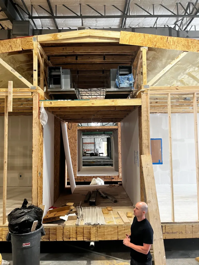 The framed end wall of a module with a window opening
