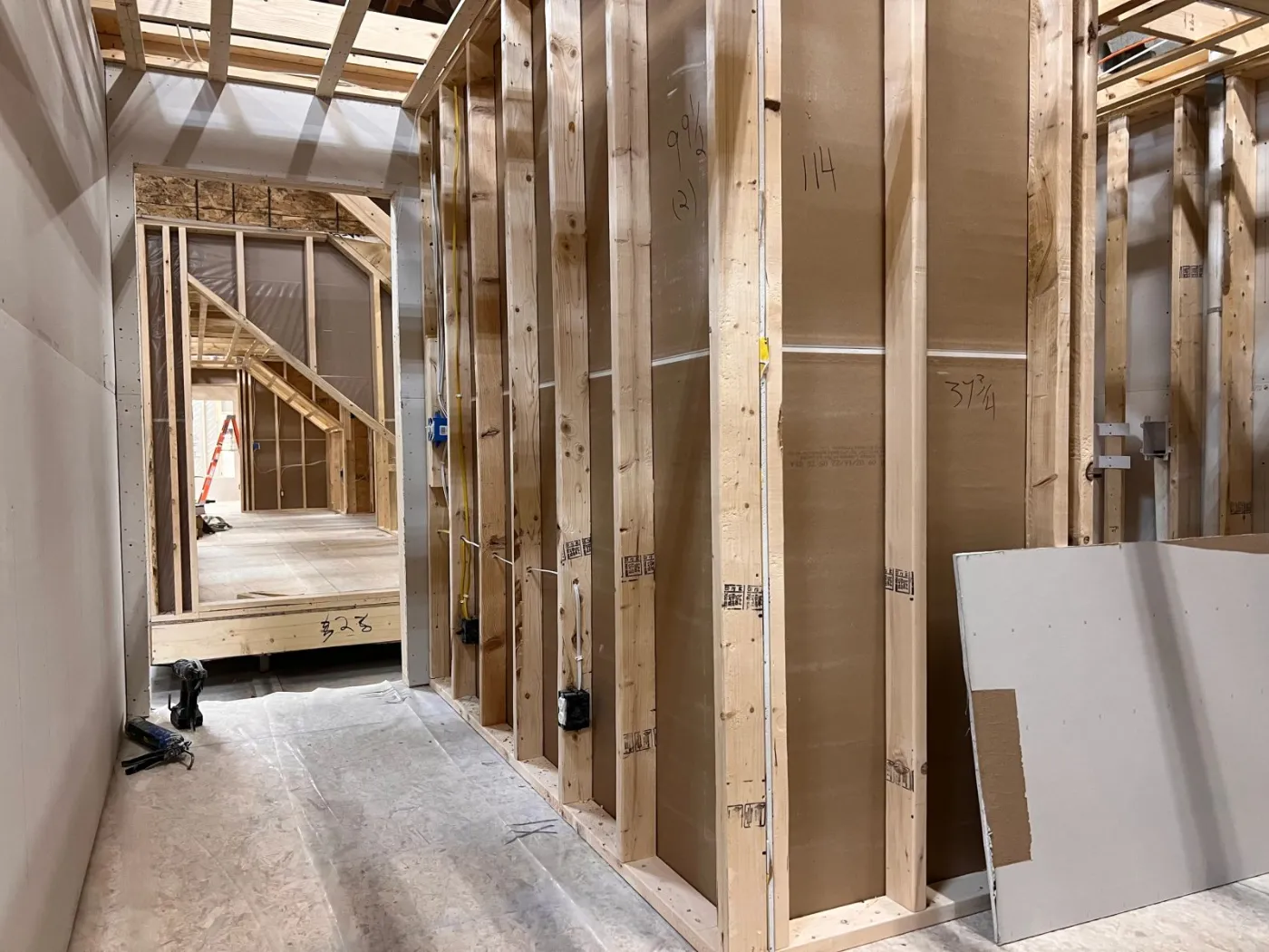 Module walls being closed in with drywall