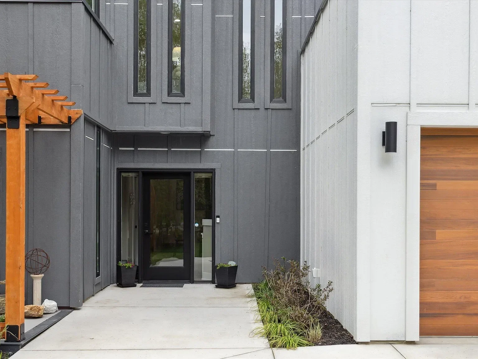 Front entrance with tall vertical windows and cedar accents