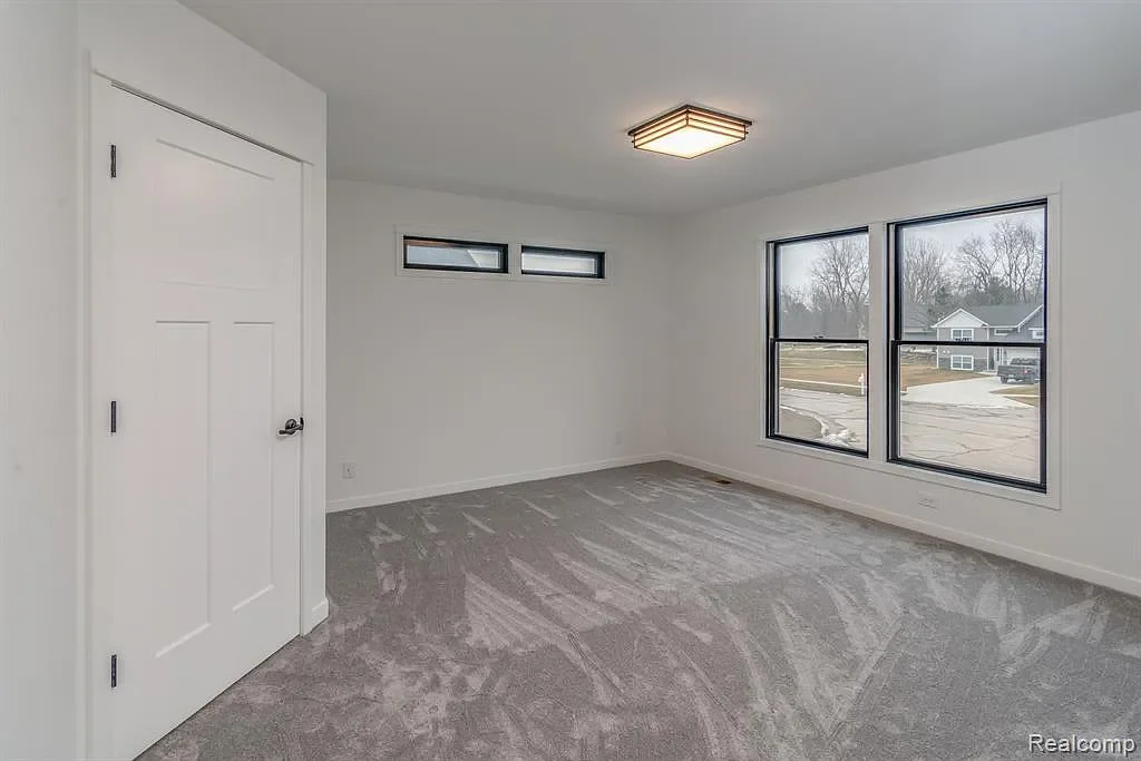 Primary bedroom with clerestory and picture windows