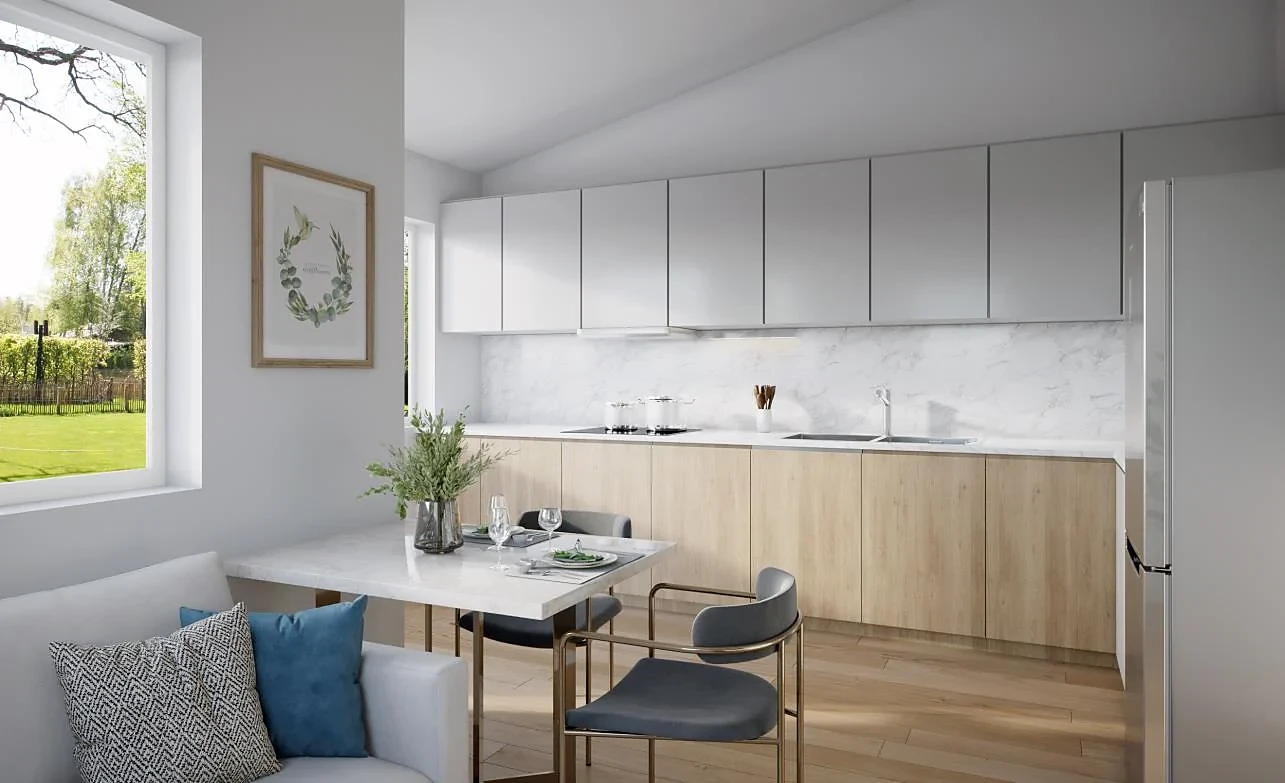 Rendering of the Pinwheel kitchen with light wood lower cabinets, gray uppers, and a small dining table by the window
